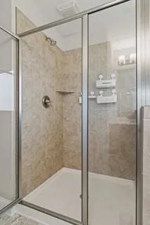 a white bath tub sitting next to a window