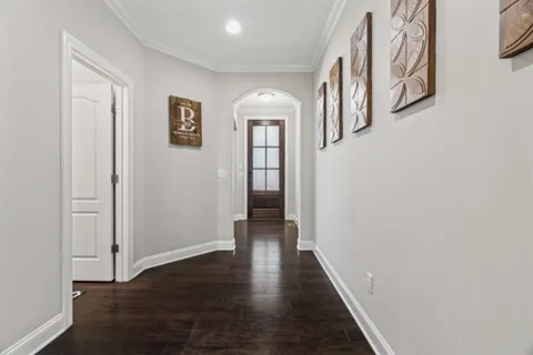 a view of hallway with wooden floor