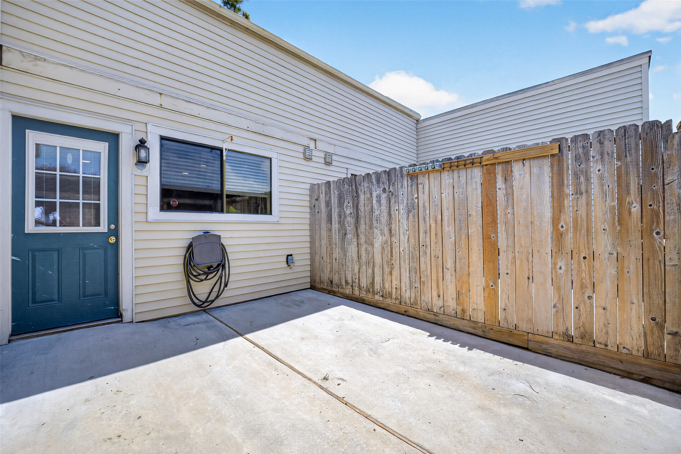 6401 Deihl Road, Unit 902 Houston, TX 77092 - Photo 25 of 35 Step into a cozy back patio oasis from the carport entrance.