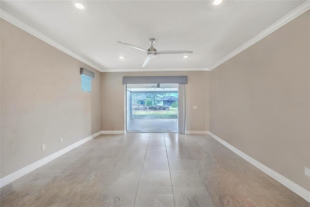 9550 Southwest 64th Lane Ocala, FL 34481 - Photo 14 of 58 wooden floor in an empty room with a window