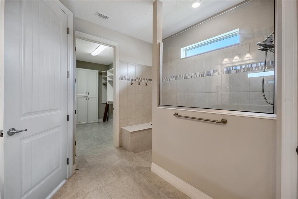9550 Southwest 64th Lane Ocala, FL 34481 - Photo 38 of 58 a bathroom with a glass shower door and a sink