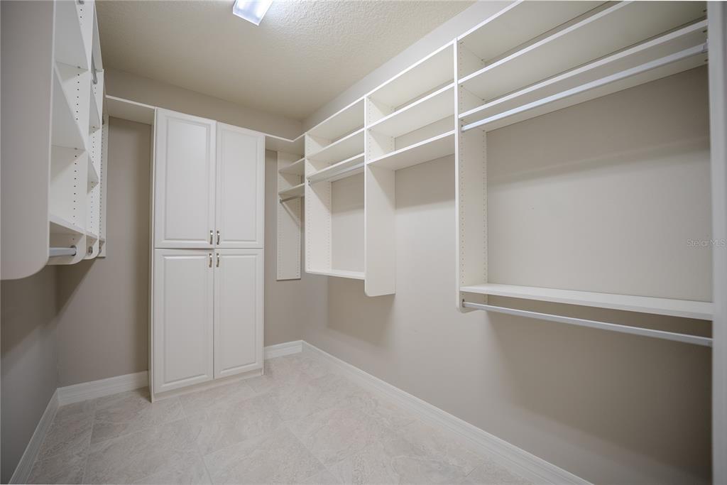 9550 Southwest 64th Lane Ocala, FL 34481 - Photo 41 of 58 a view of walk in closet with empty racks