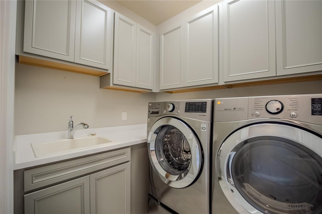 9550 Southwest 64th Lane Ocala, FL 34481 - Photo 43 of 58 a utility room with sink dryer and washer