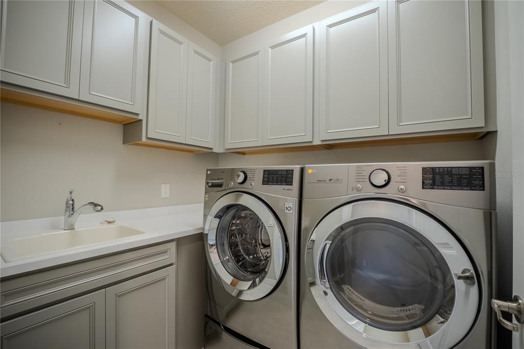 9550 Southwest 64th Lane Ocala, FL 34481 - Photo 44 of 58 a utility room with sink dryer and washer