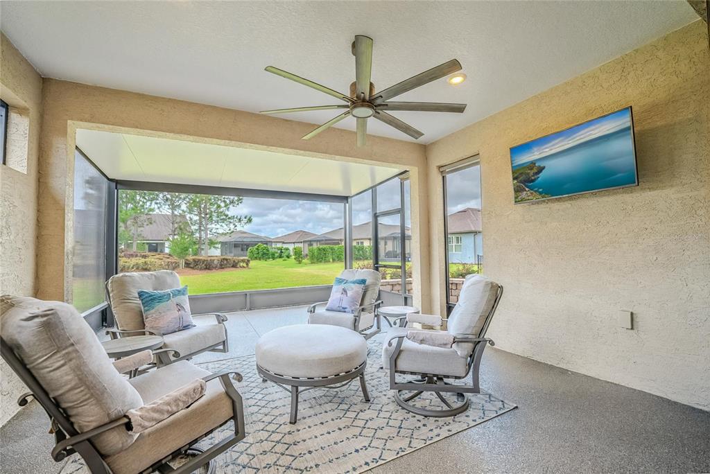 9550 Southwest 64th Lane Ocala, FL 34481 - Photo 48 of 58 a living room with furniture and a large window