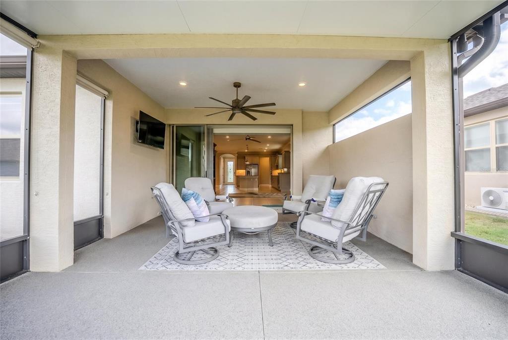 9550 Southwest 64th Lane Ocala, FL 34481 - Photo 50 of 58 a living room with furniture and large windows