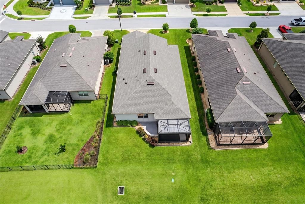 9550 Southwest 64th Lane Ocala, FL 34481 - Photo 53 of 58 an aerial view of a house with a garden and swimming pool