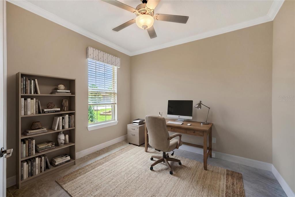 9550 Southwest 64th Lane Ocala, FL 34481 - Photo 8 of 58 a view of a workspace with furniture and a window