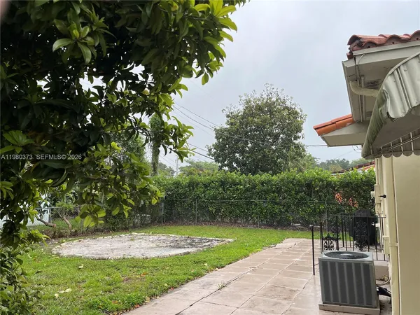 a view of a patio with a yard