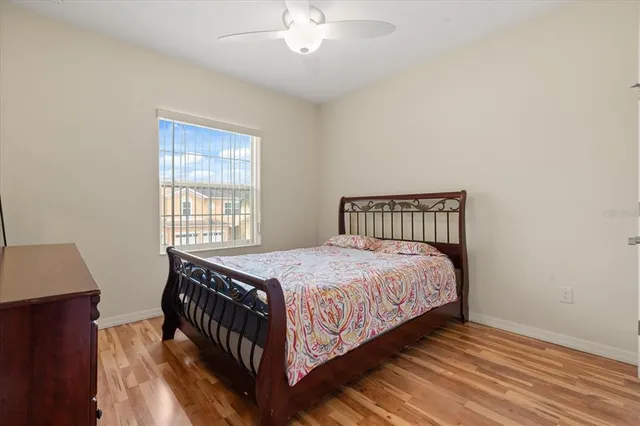 a bedroom with a bed and a window