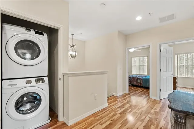 a view of a hallway with washer and dryer