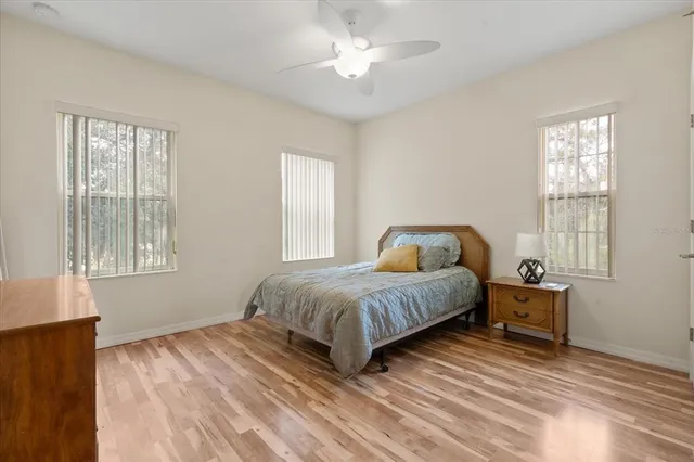 a spacious bedroom with a bed and a window