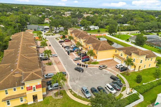 an aerial view of residential houses with outdoor space