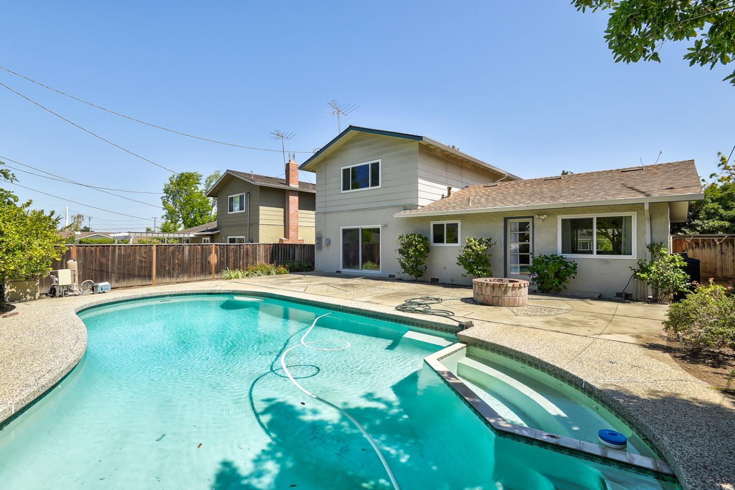 979 Pocatello Avenue Sunnyvale, CA 94087 - Photo 2 of 2 a view of a house with swimming pool and sitting area
