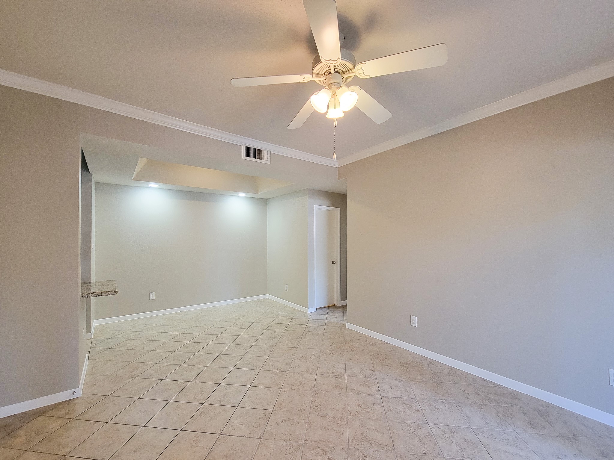 4041 Drake Street, Unit 116 Houston, TX 77005 - Photo 13 of 27 an empty room with fan and fan