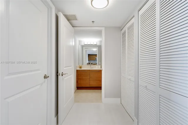 a bathroom with a shower and a sink