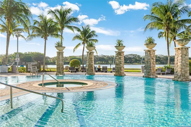 a swimming pool with outdoor seating and yard