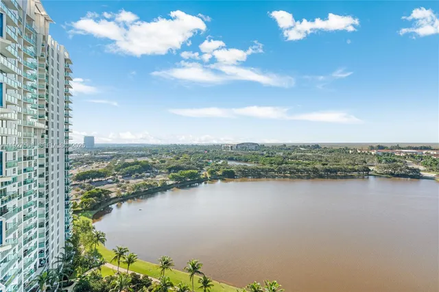 a view of a lake with a city