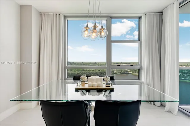 a view of a living room with furniture and window