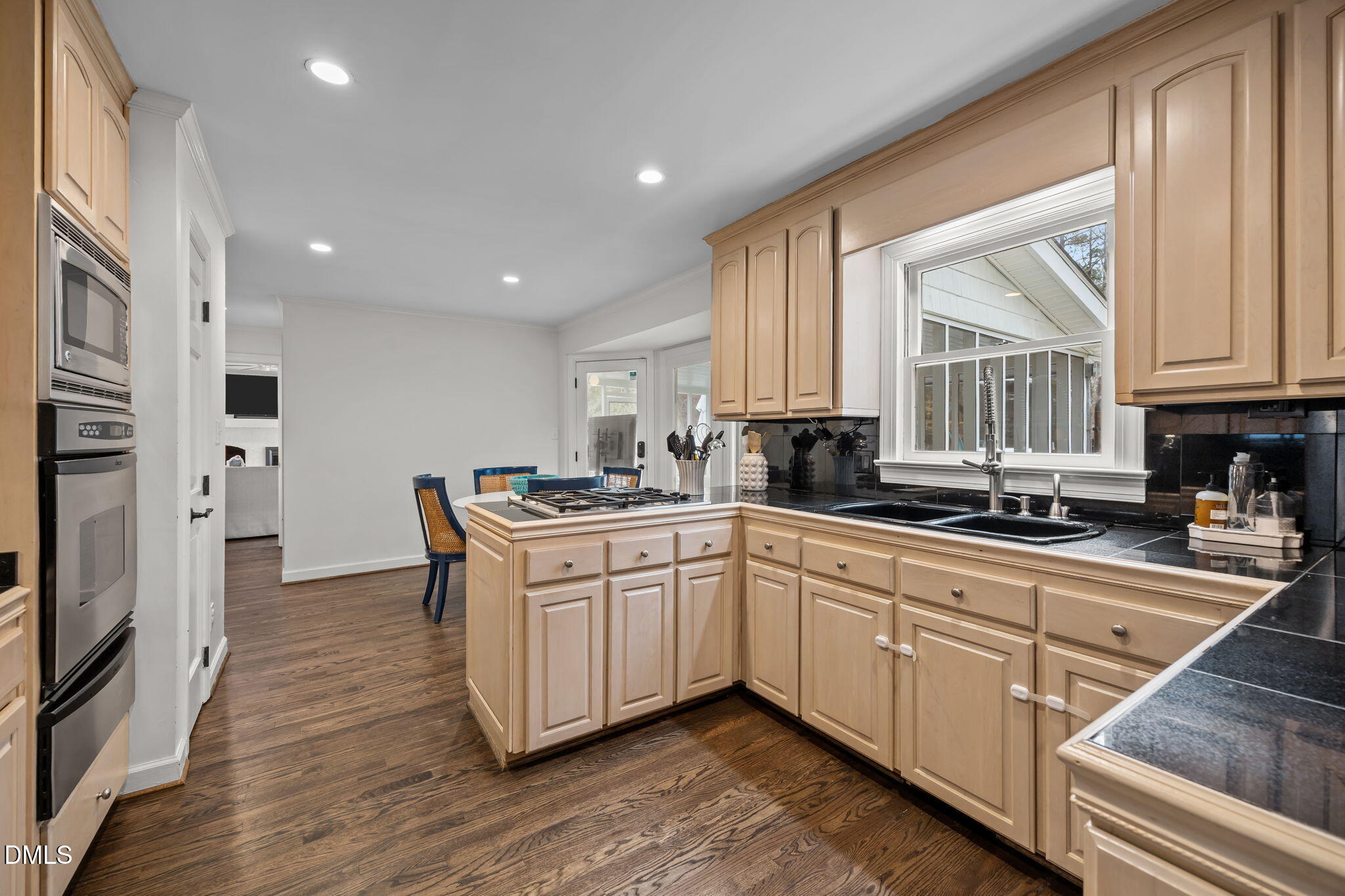 1120 Queensferry Road Cary, NC 27511 - Photo 14 of 62 a kitchen with stainless steel appliances granite countertop a stove a sink and a refrigerator
