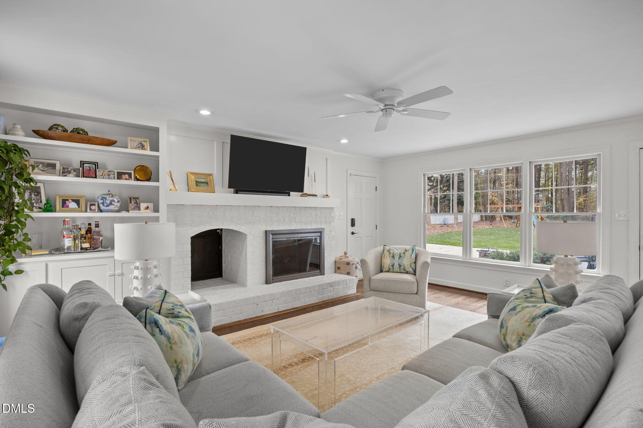 1120 Queensferry Road Cary, NC 27511 - Photo 21 of 62 a living room with furniture a fireplace and a flat screen tv