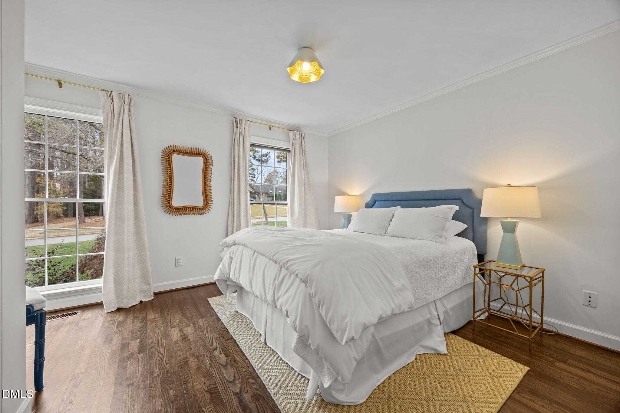 1120 Queensferry Road Cary, NC 27511 - Photo 38 of 62 a bedroom with a bed lamps and window
