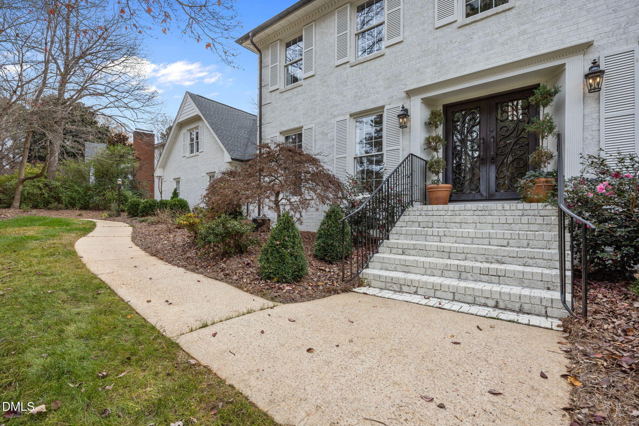 1120 Queensferry Road Cary, NC 27511 - Photo 4 of 62 a front view of a house with garden