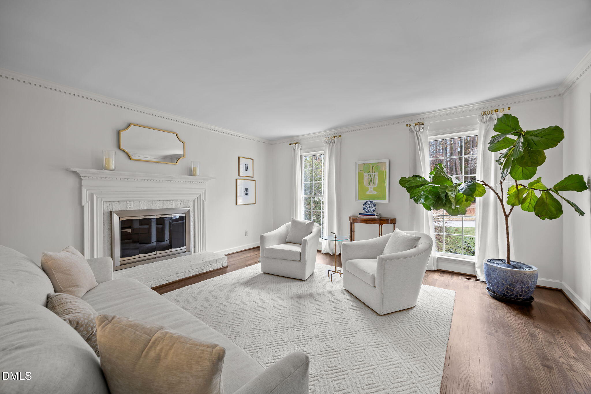 1120 Queensferry Road Cary, NC 27511 - Photo 8 of 62 a living room with furniture a fireplace and potted plant
