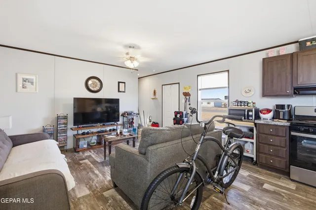 a living room with furniture and a flat screen tv