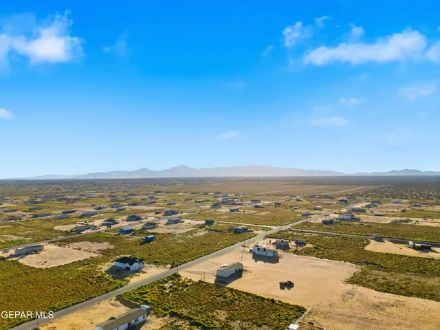 an aerial view of residential building and ocean