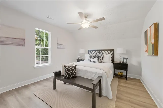 a bedroom with furniture and windows