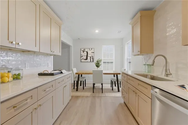 a kitchen with a sink stove and microwave