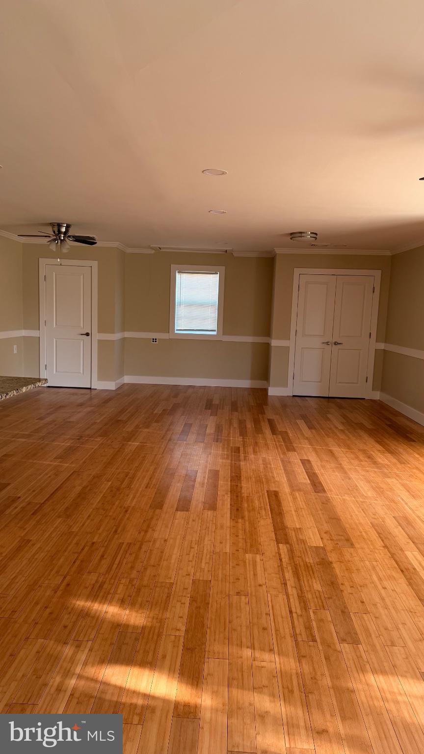 1110 High Street Cambridge, MD 21613 - Photo 4 of 22 Spacious room with warm bamboo floors.