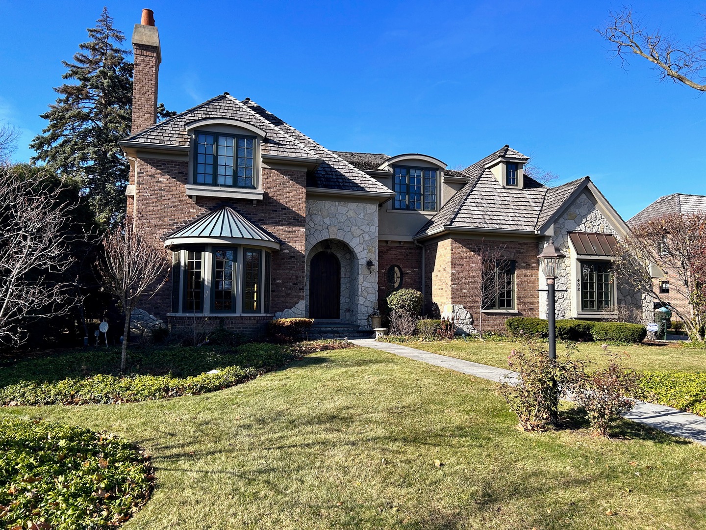 408 Elmore Street Park Ridge, IL 60068 - Photo 1 of 5 a front view of a house with a yard