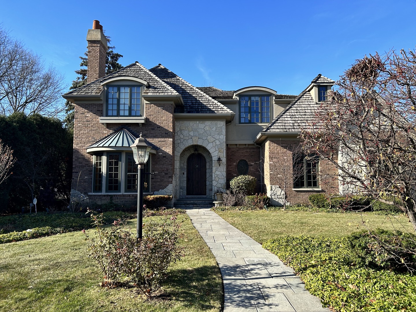 408 Elmore Street Park Ridge, IL 60068 - Photo 2 of 5 a front view of a house with garden