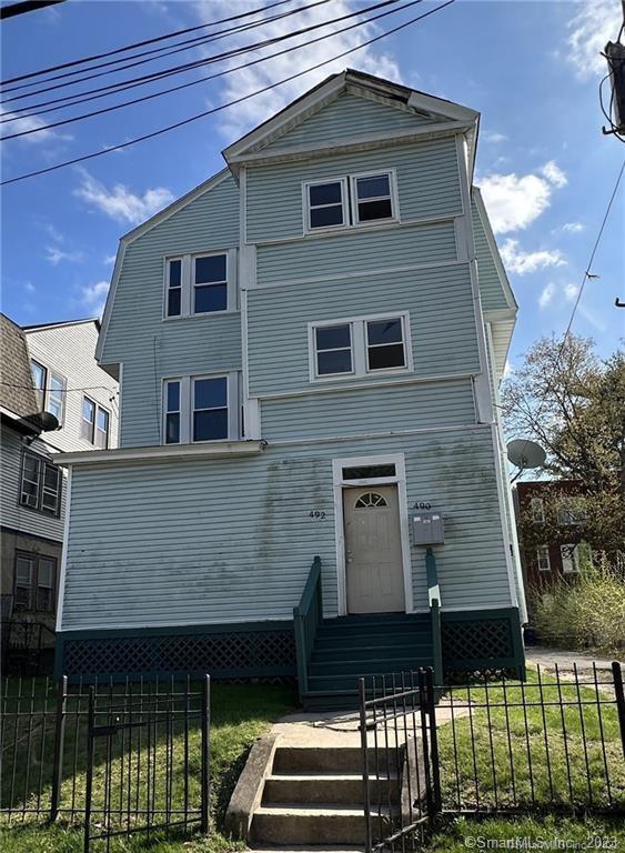 490 Edgewood Street, Unit 2 Hartford, CT 06112 - Photo 1 of 1 a front view of a house with parking