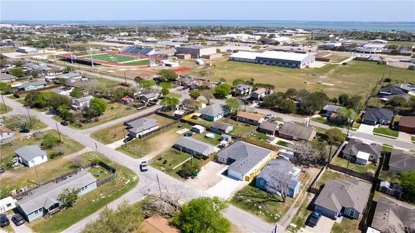 an aerial view of residential houses with outdoor space