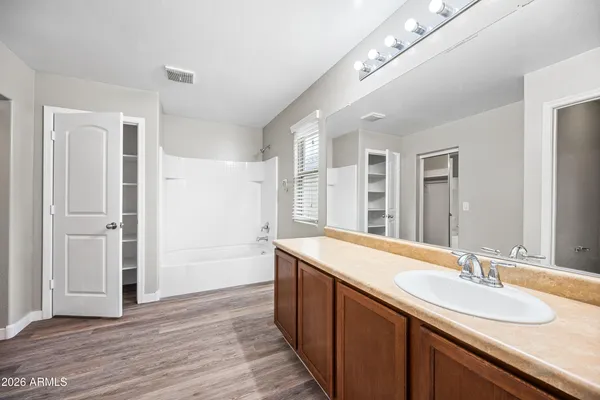 a bathroom with a sink double vanity and a mirror