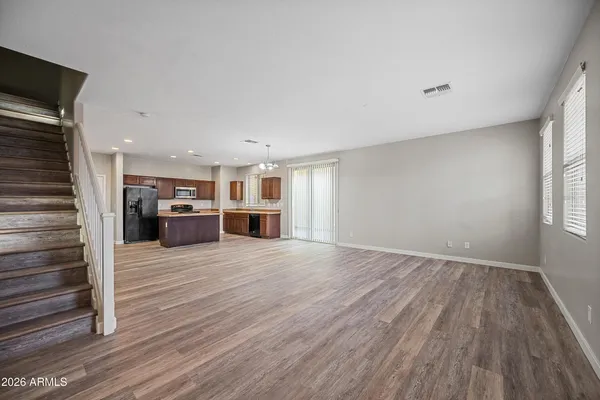 a view of kitchen and wooden floor