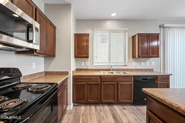 a kitchen with a stove and a sink