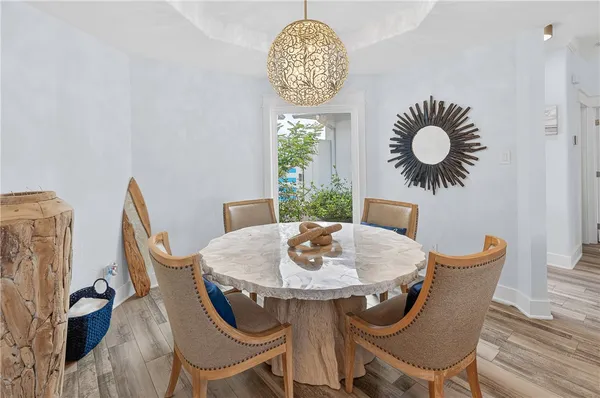 a dining room with furniture and window