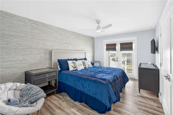a bedroom with a bed and a couch