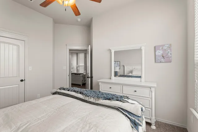 a bedroom with a bed and a dresser