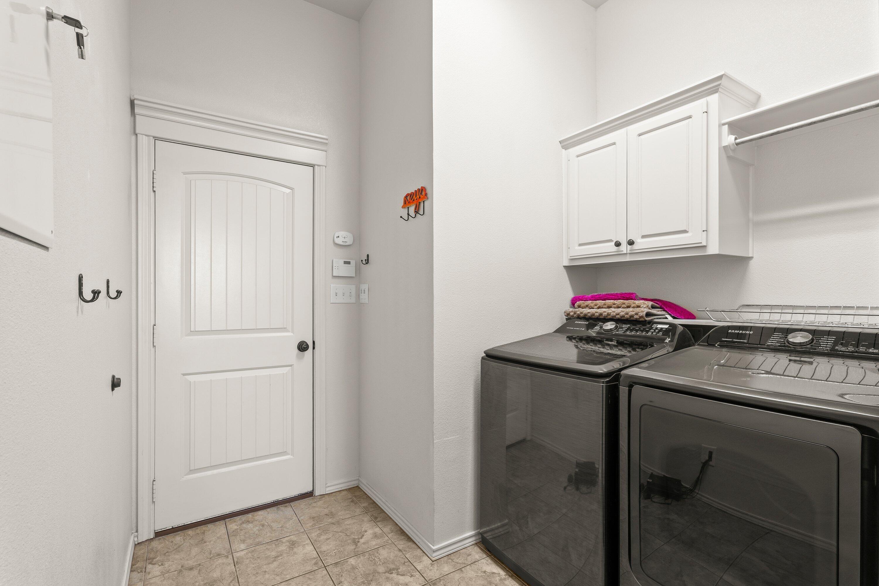6305 93rd Street Lubbock, TX 79424 - Photo 28 of 31 a kitchen with stainless steel appliances granite countertop a stove and a refrigerator