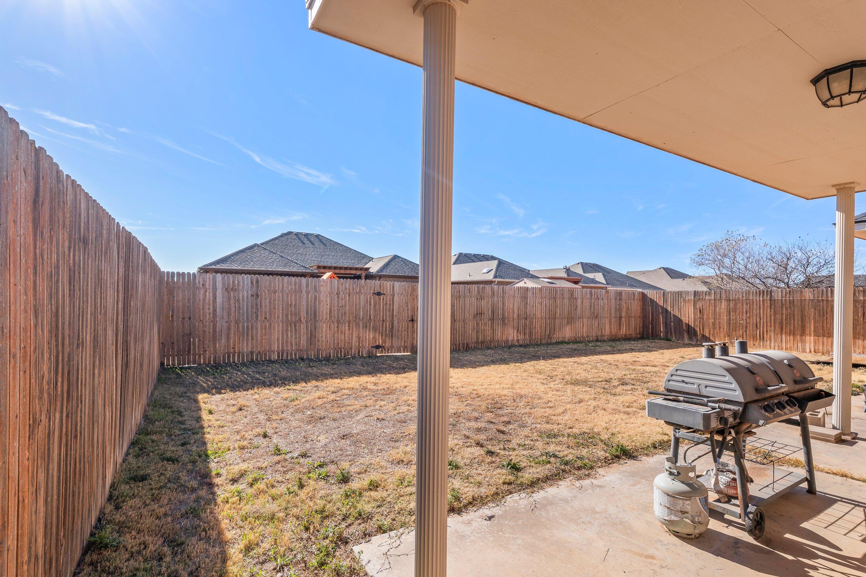 6305 93rd Street Lubbock, TX 79424 - Photo 29 of 31 a view of a backyard of a house