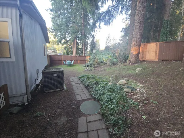 a backyard of a house with lots of green space