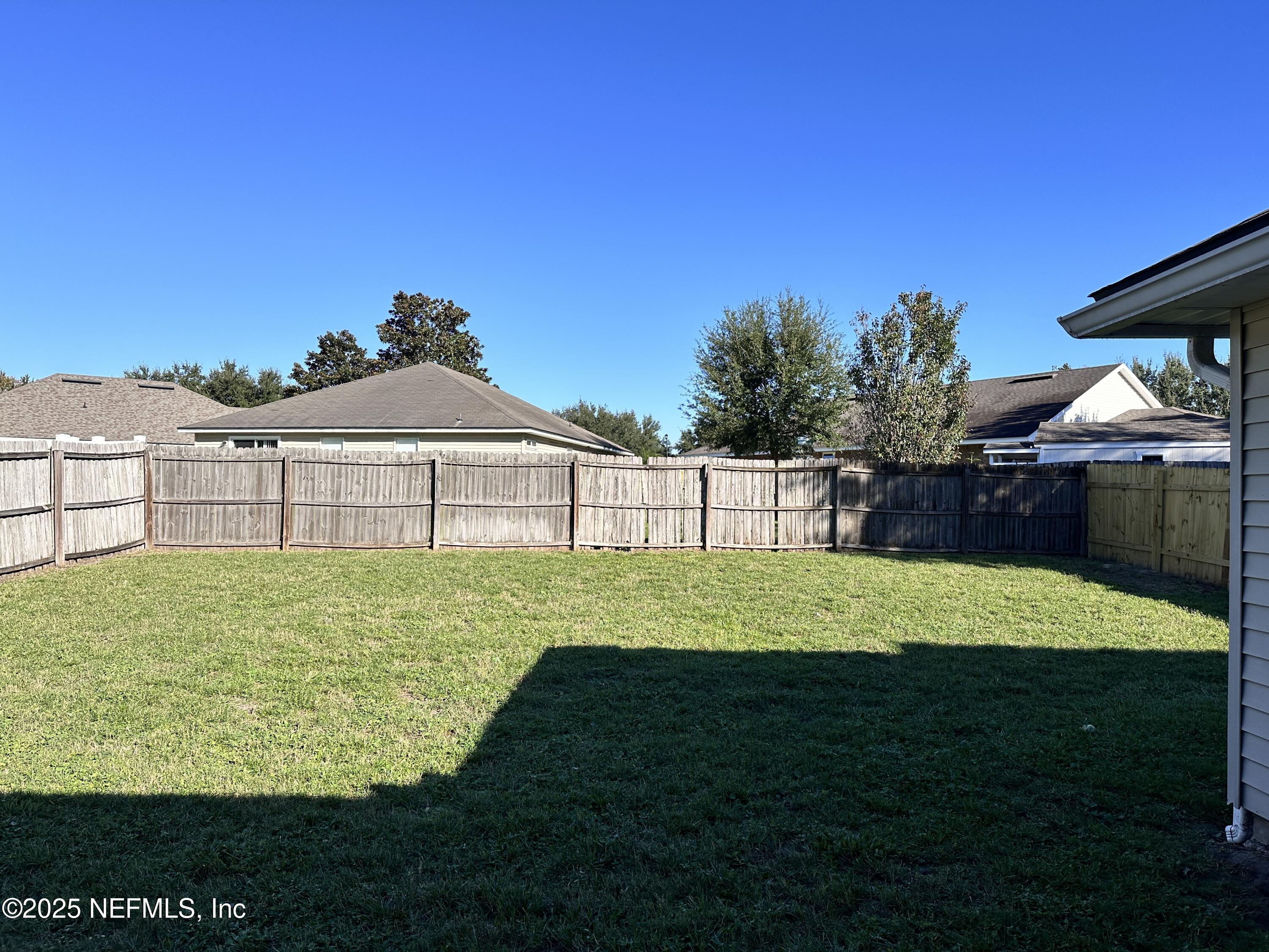 2786 Cross Creek Drive Green Cove Springs, FL 32043 - Photo 13 of 16 a view of a backyard with a garden and plants