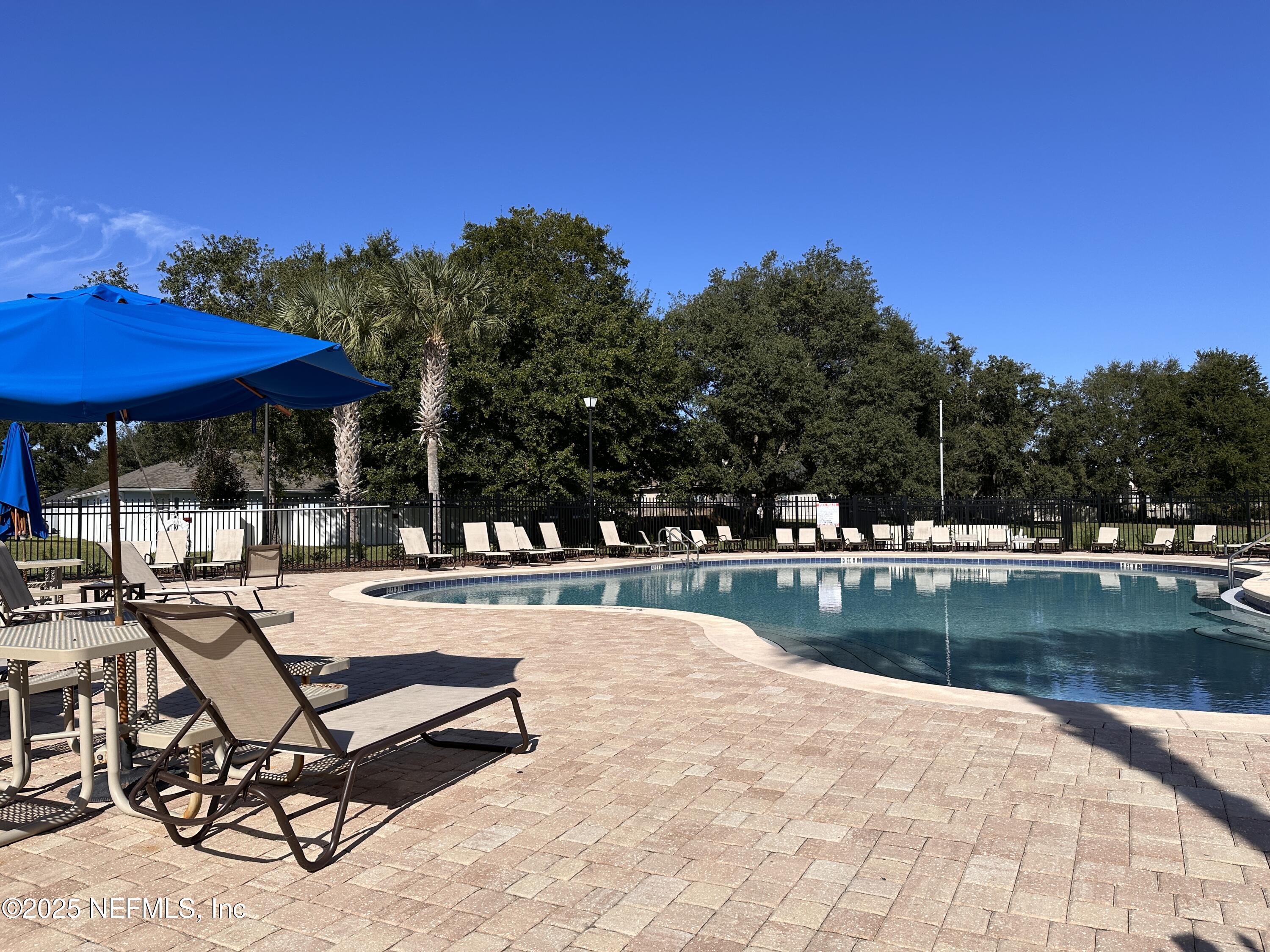2786 Cross Creek Drive Green Cove Springs, FL 32043 - Photo 16 of 16 a view of a swimming pool with chairs in patio
