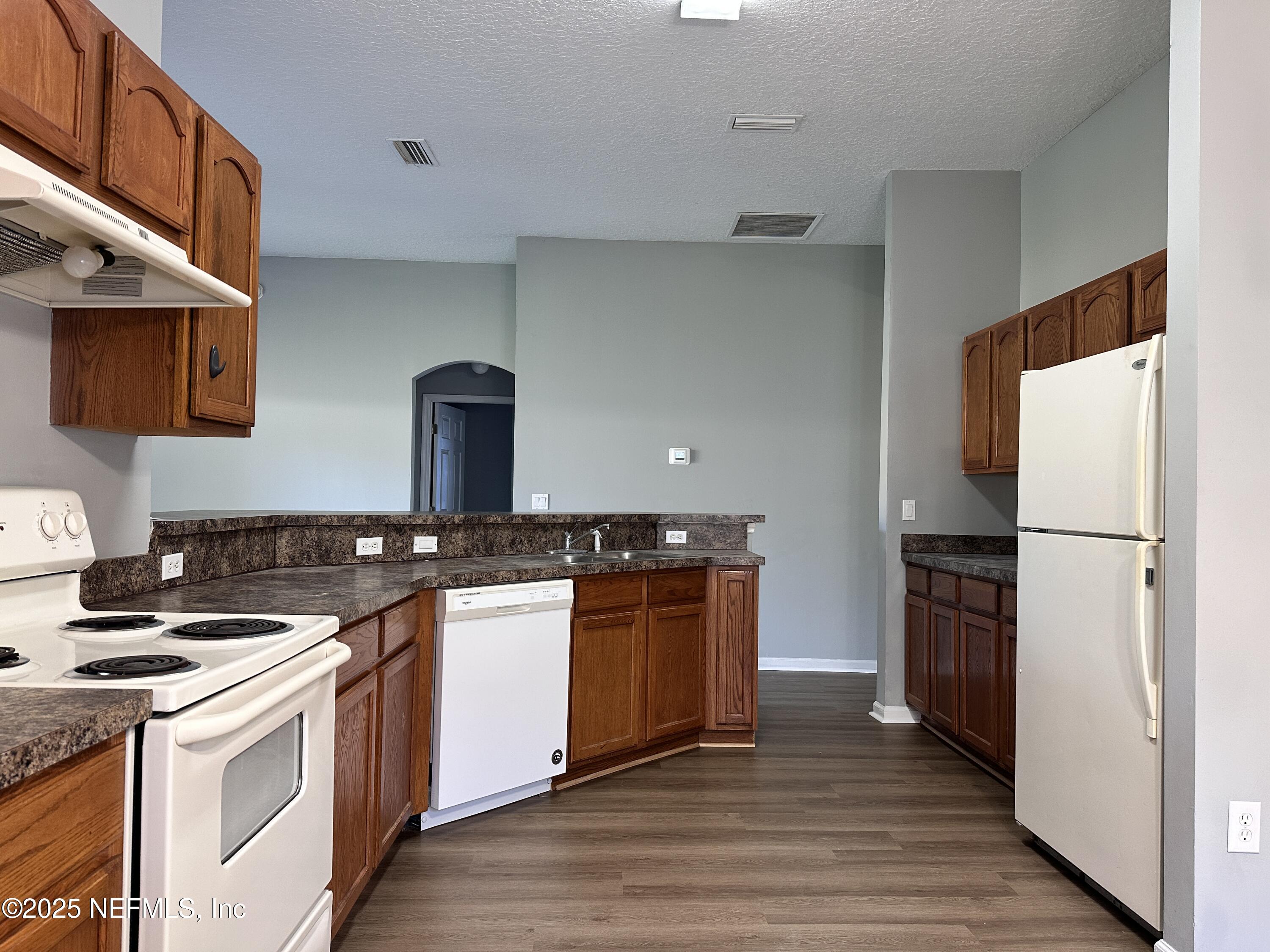 2786 Cross Creek Drive Green Cove Springs, FL 32043 - Photo 3 of 16 a kitchen with a stove and a refrigerator