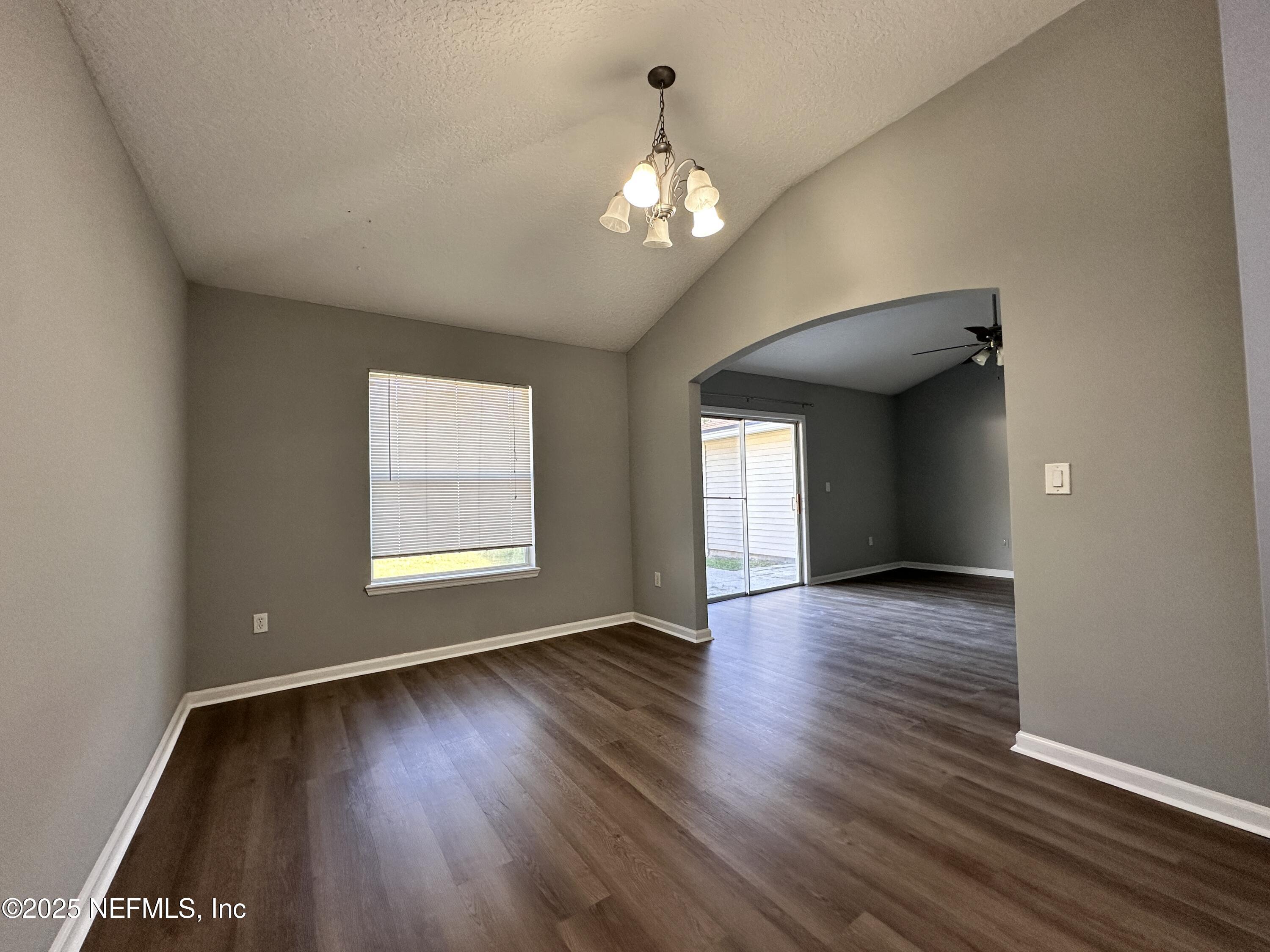 2786 Cross Creek Drive Green Cove Springs, FL 32043 - Photo 5 of 16 a view of an empty room with wooden floor and a window